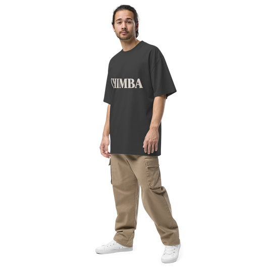 Camiseta oversized faded negra con texto crema "CHIMBA" — streetwear paisa colombiano PaisaRican